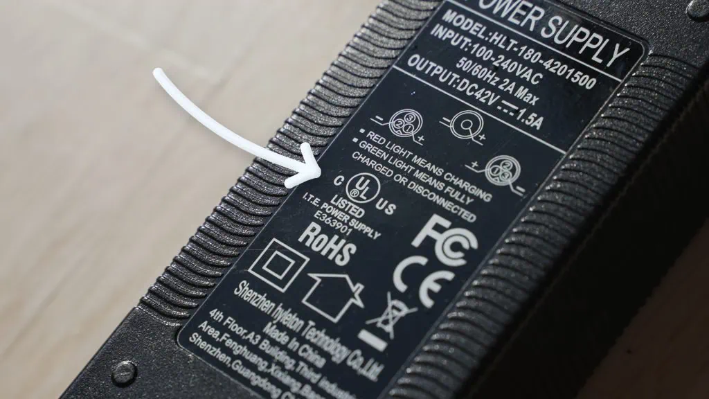 Need A New Hoverboard Charger? Your Safe Buying Guide 3 Arrow pointing to UL certification on a hoverboard charger