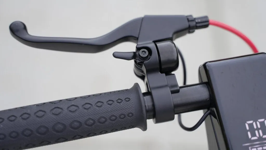 TurboAnt X7 Max Review: Portability & Performance at a Low Price 51 Closeup of brake lever and mechanical bell on turboant x7 max e scooter