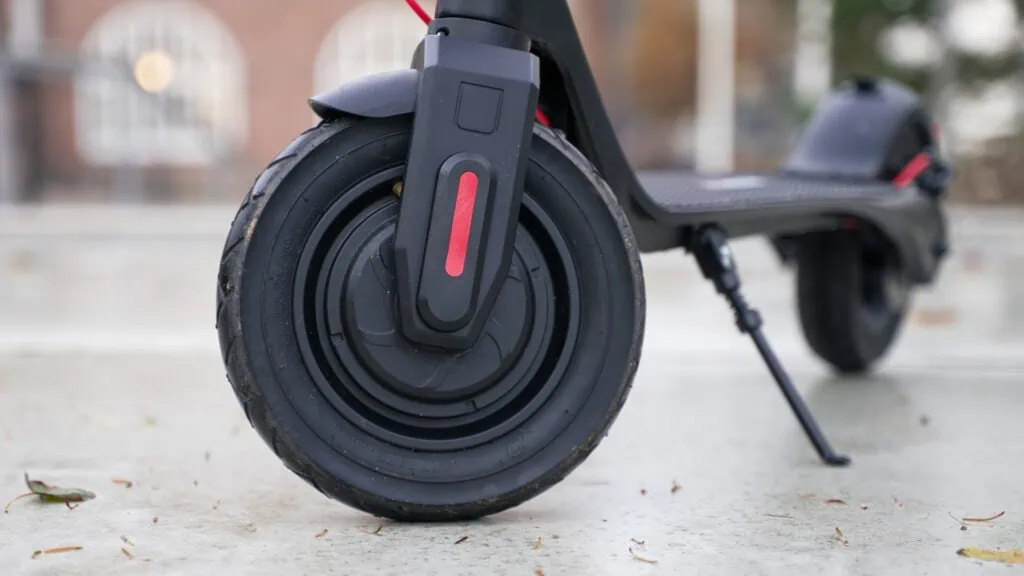 TurboAnt X7 Max Review: Portability & Performance at a Low Price 39 Closeup of the front wheel hub motor on the TurboAnt X7 Max electric scooter