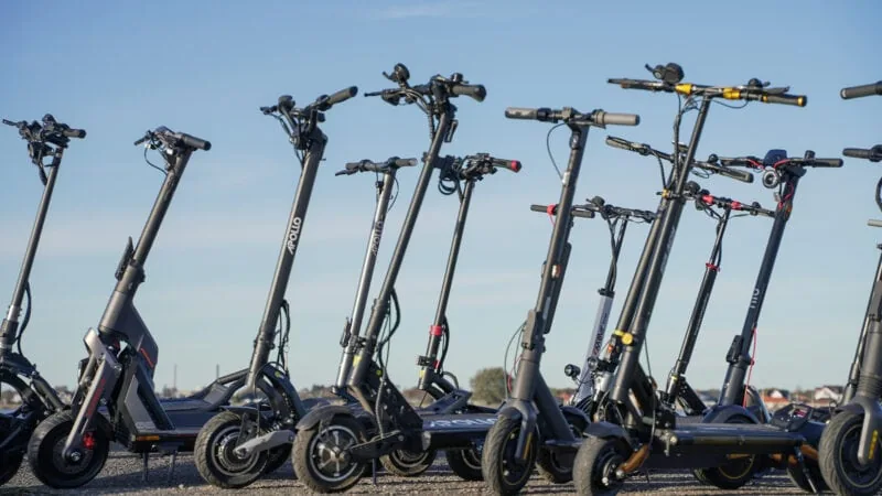 Many electric scooters standing next to each other, all owned and tested by ERideHero