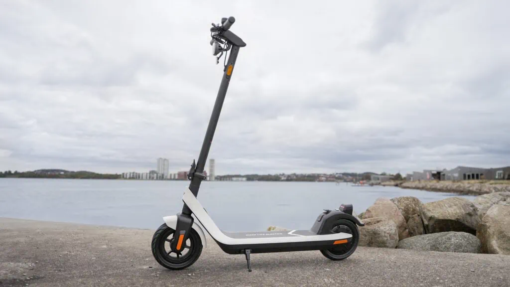 NIU KQi2 Pro electric scooter with scenic fjord in the background