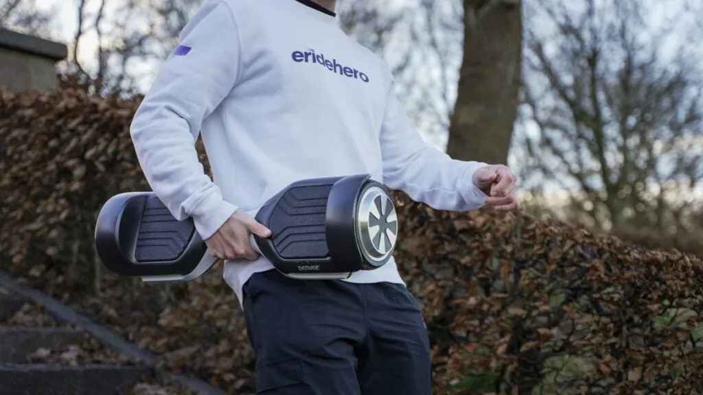The 10 Best Hoverboards in 2025 14 Rasmus Barslund from ERideHero carrying a hoverboard to show off its portability
